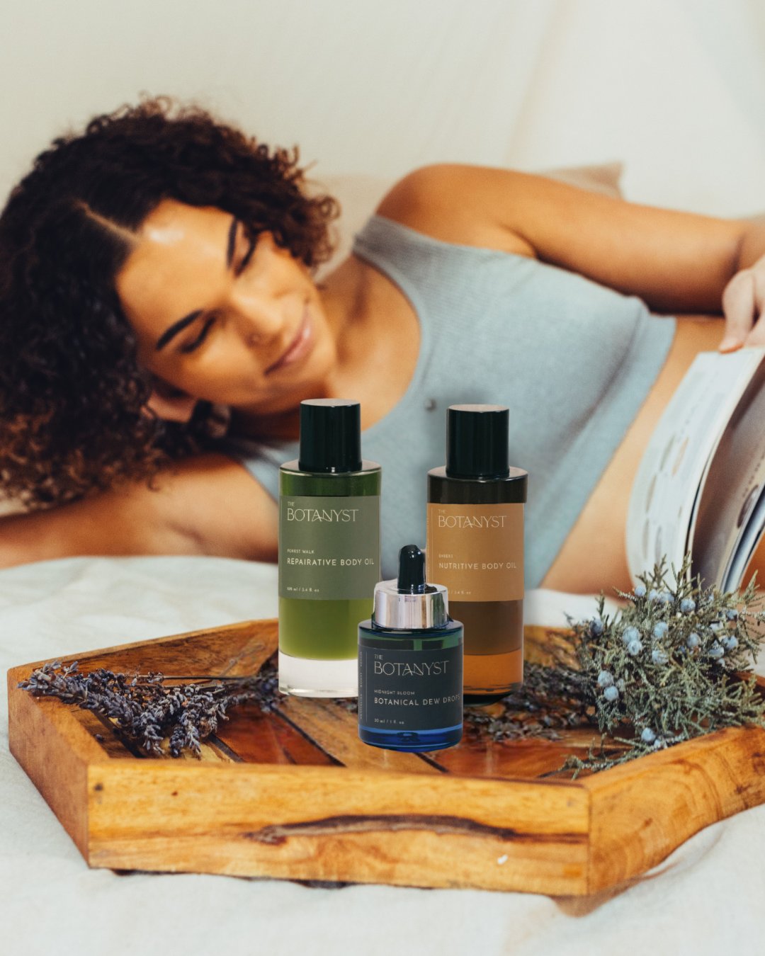 Body care by The Botanyst women with body oil bottles